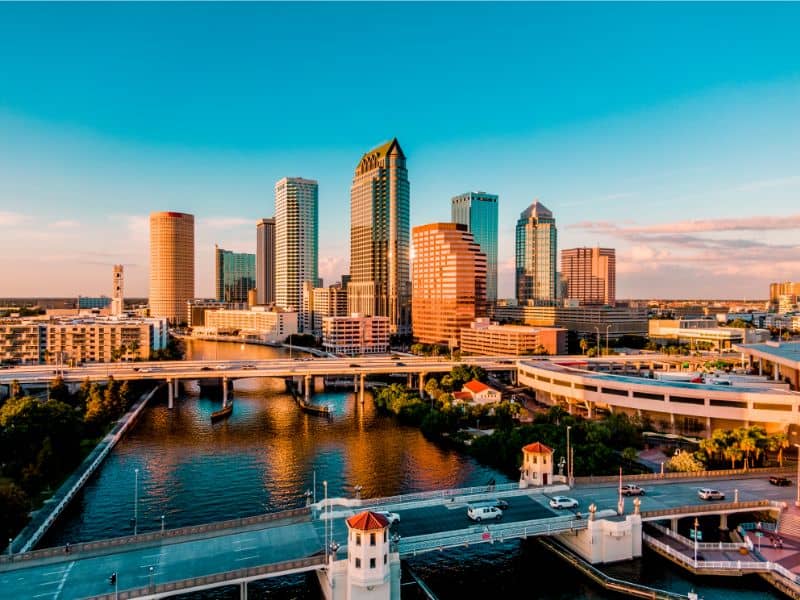 Aerial view of downtown Tampa FL skyline with river and bridges representing professional land surveying services in the Tampa area